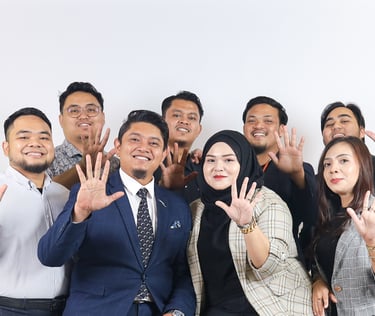 a group of people standing around a man in a suit