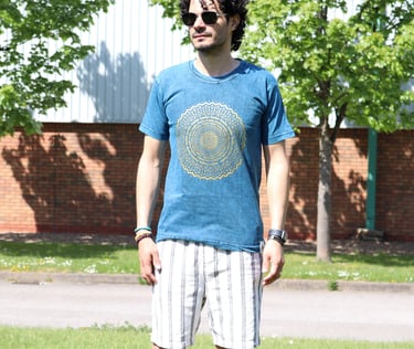 a man standing on a skateboard in the grass