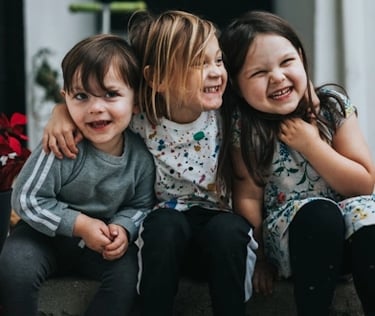 Three children laughing