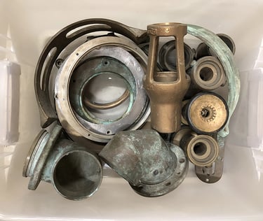 Metal parts in a sculptor's workshop bin, image 6.