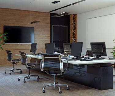 a conference room with a desk and a television