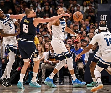 APRIL 27: Nikola Jokic (15) of the Denver Nuggets gets a hand on the ball as Jaden McDaniels, Rudy Gobert and Mike Conley