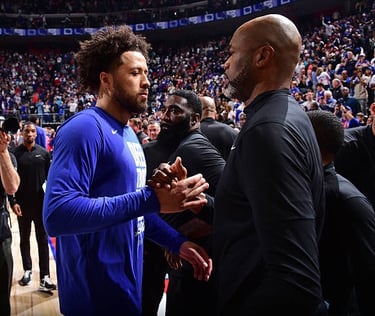 Cade Cunningham (left) and Magic head coach Jamahl Mosley (right) shake hands following the Pistons game 7 victory.
