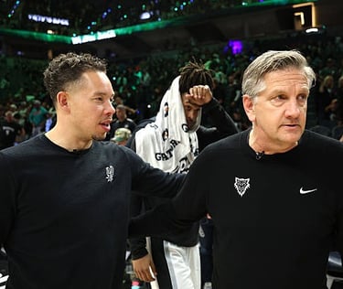 Mitch Johnson and Chris Finch, head coaches of the Spurs and Timberwolves, during game 6 (May 15, 2026)