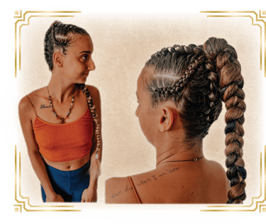 a woman with her hair done for a festival with braids and cornrows