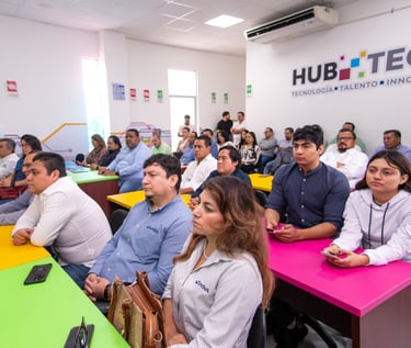 Professionals attend a corporate training session at Hub Tech for technology and innovation.