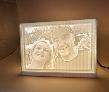Custom 3D printed lithophane lamp featuring a backlit portrait of a smiling couple.