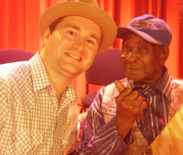 Giving some blues folk art to David "Honeyboy" Edwards