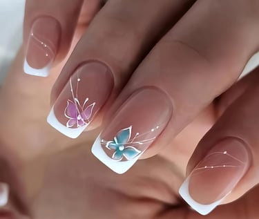 a woman's hand painted nails with a butterfly on her nails