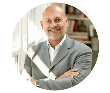 a lawyer man in a suit and tie smiling