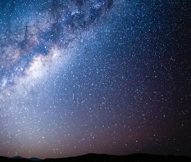 a person standing in front of a night sky