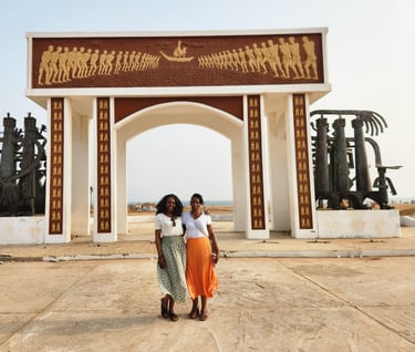 Tourists visiting Slave Door of No Return in Benin