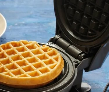 a waffler on a plate with two waffles on it