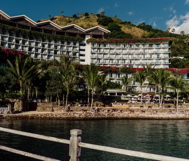 a large building with a boat in the water