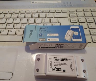 Sonoff basic WiFi smart switch and box.