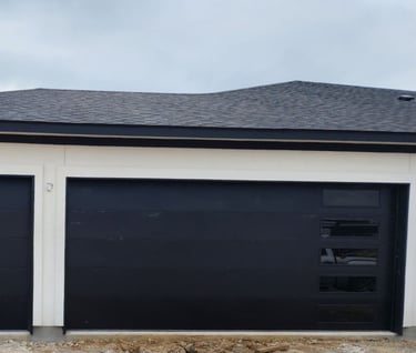1 8x8 flush black garage door and 1 16x8 black flush with windows on the right hand side garage door
