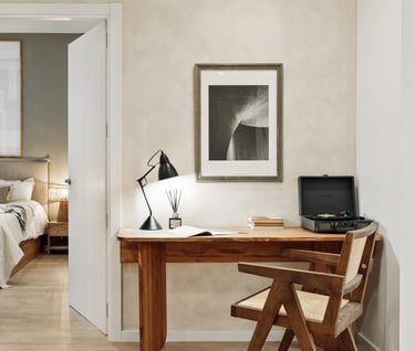 Elegant bedroom with custom artwork and brown and beige colour palette in Barcelona