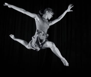 3rd stage dancer Sara Mather doing a contemporary stag jump