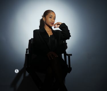 Ruby sitting in a chair with a cigarette in her hand