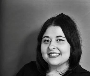 Black and white professional headshot of Emma Santos 