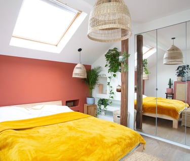 a bedroom with a bed and a mirror