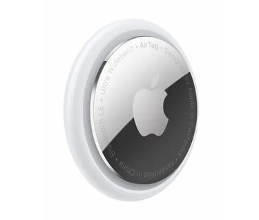 a round mirror with a white apple logo