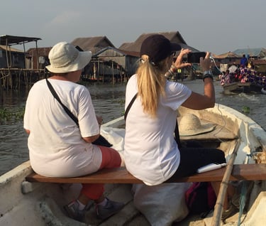 Tourists Visiting Ganvie stilt village during a Multi-country Trips of Senegal, Ivory Coast & Benin
