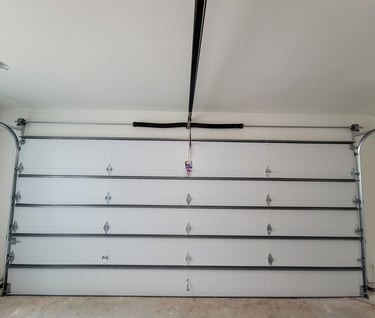 Garage door installed by A's garage doors in Austin tx with a modern garage door torsion spring