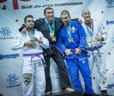 a group of people standing on a stage with medals