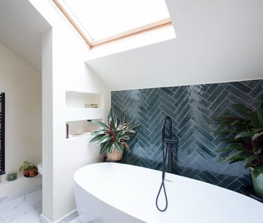 a bathroom with a bathtub and a skylight