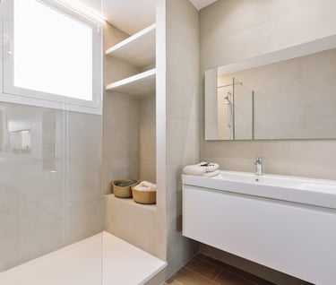 Modern bathroom design with in-built shower and natural stone tiles
