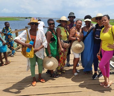 Haitian Diasporas visiting Ganvie Stilt Village in Benin during A multi-country tours