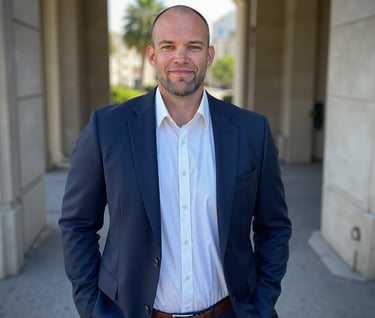 Matti Kesti in a suit standing in front of a building.