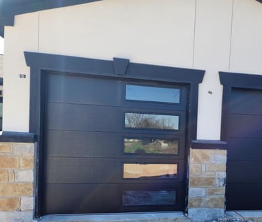 Custom 8x8 black flush Garage doors with window panels on the right hand side