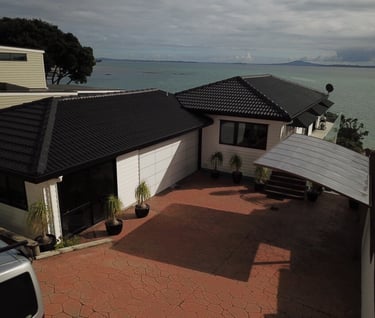 New roof and reclad water front home