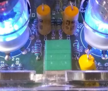 front view of valve head phones amplifier with tubes glowing blue