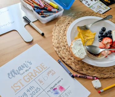 homeschool day with breakfast on table alongside crayon box and school stuff