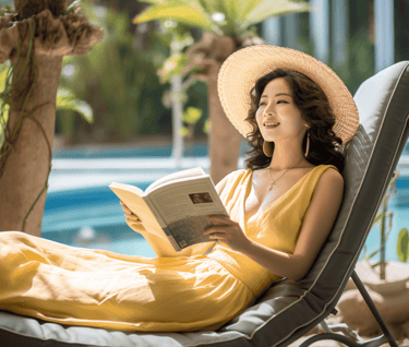 Woman reading by the swimming pool