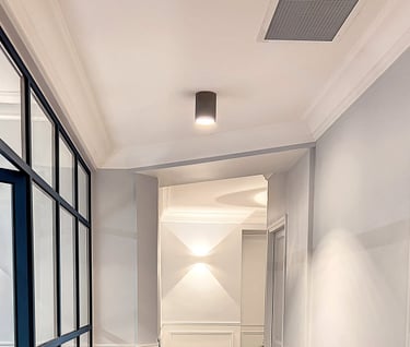 a hallway with a wooden floor and a door