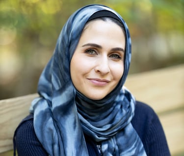 a mental health therapist in Indiana and Kentuckyin a blue scarf and scarf around her neck