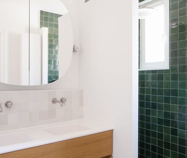 a bathroom with a mirror and a mirror