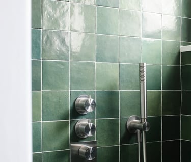 a shower with a shower head and a shower head