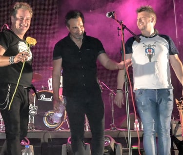 a group of men standing on a stage