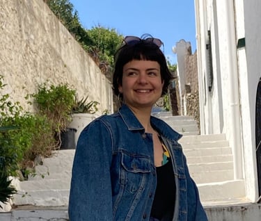 a woman in a denim jacket and jeans jacket