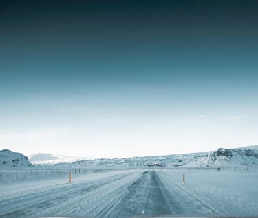 a car driving down a snowy road
