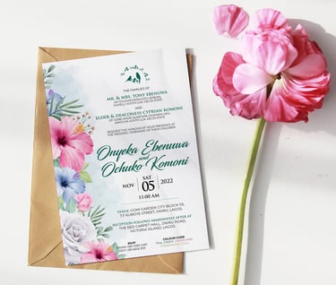 a wedding invitation card with a flower