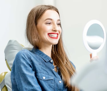 a woman with a smile on her face and a mirror in front of her