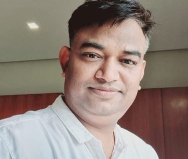 a man in a white shirt and tie dye on his shirt