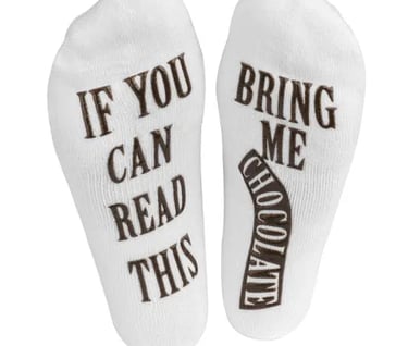 a pair of socks with the words, if you can't read this,