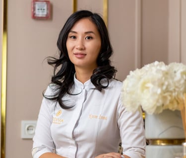 a woman in a white shirt and a vase with flowers
